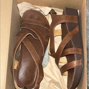 OluKai Nana Sandals in Rich Brown